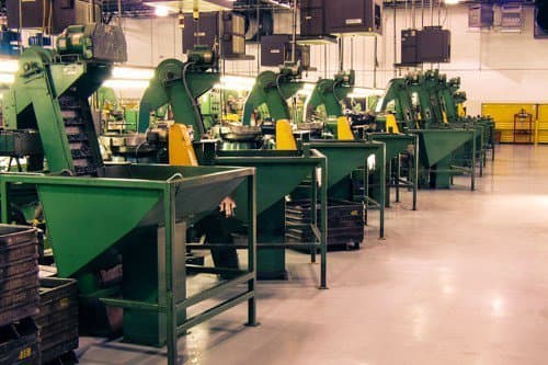 Production line of forming machines and feeder hoppers at the AFI plant